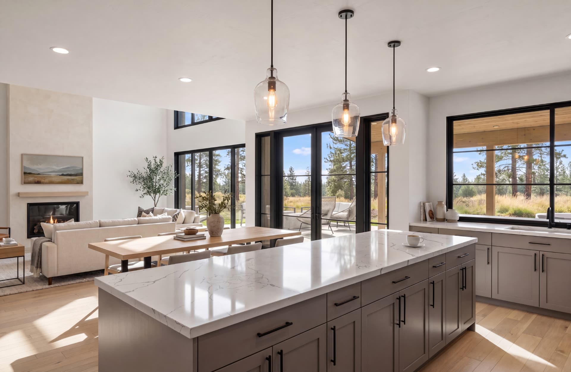 Suncadia house interior — kitchen island with marble countertops and pendant lighting